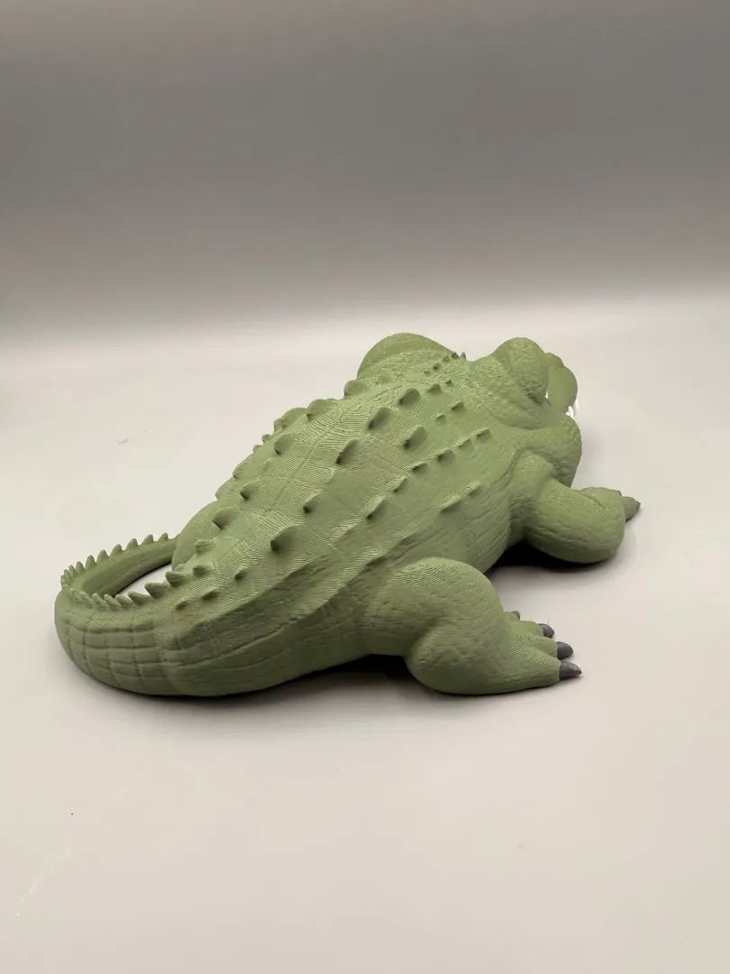 Grumpy Alligator sculpture, side view