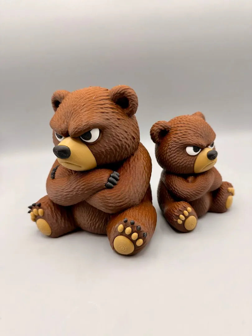 Grumpy Big Bear beside the standard-size Grumpy Bear for scale