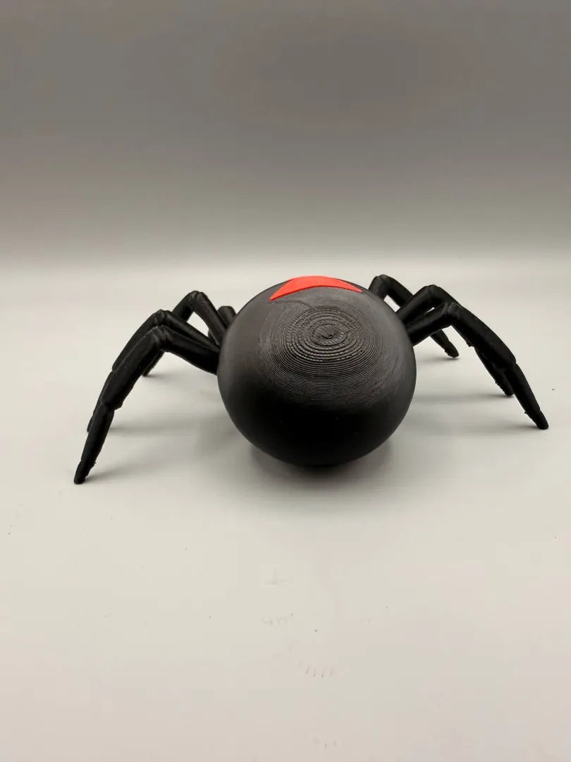Grumpy Black Widow sculpture, side view