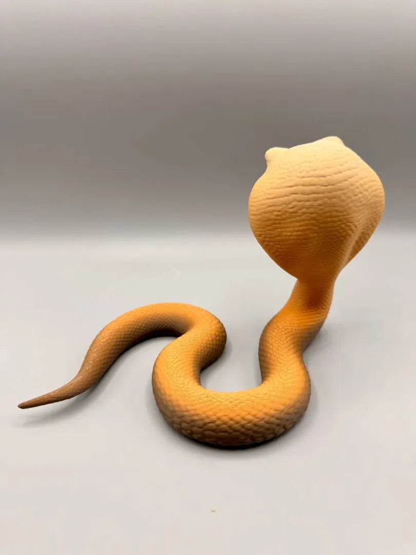 Grumpy Cobra sculpture, rear three-quarter view