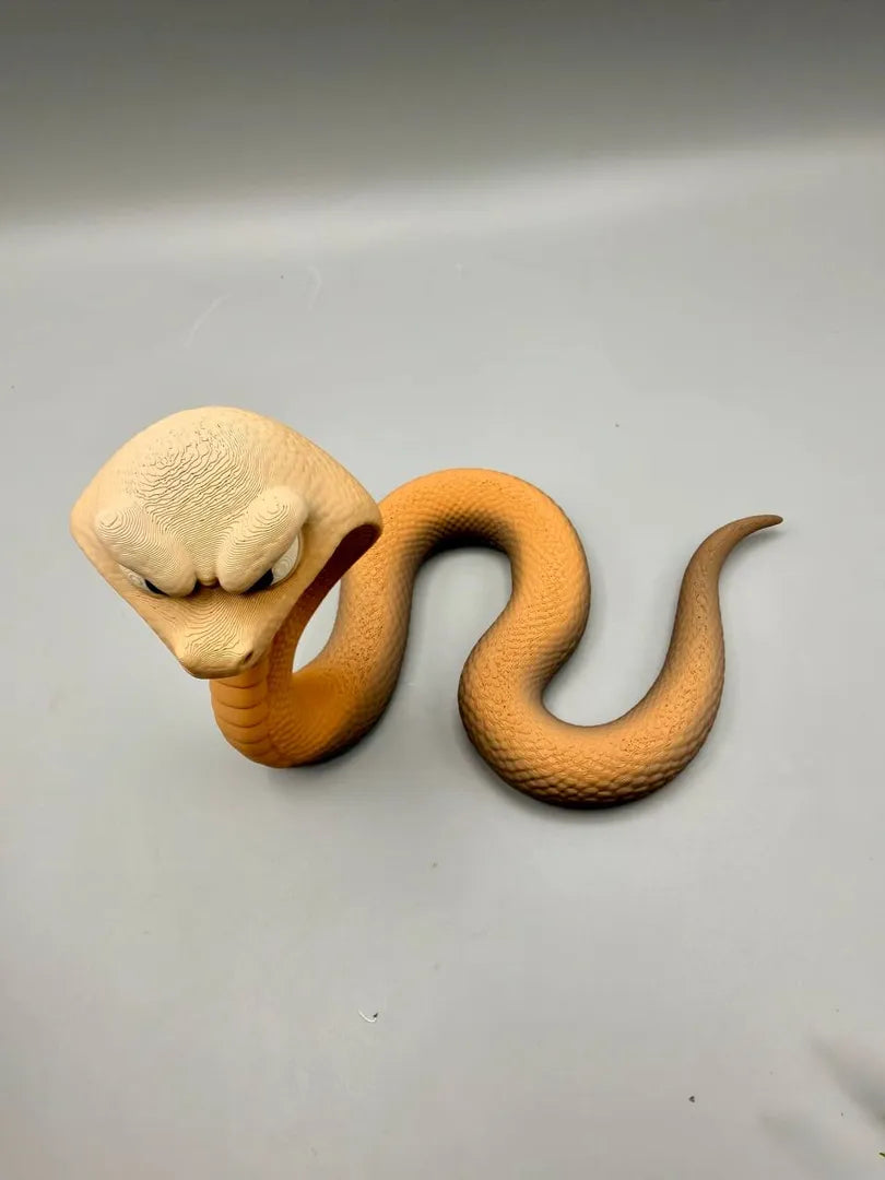 Grumpy Cobra sculpture, top-down view