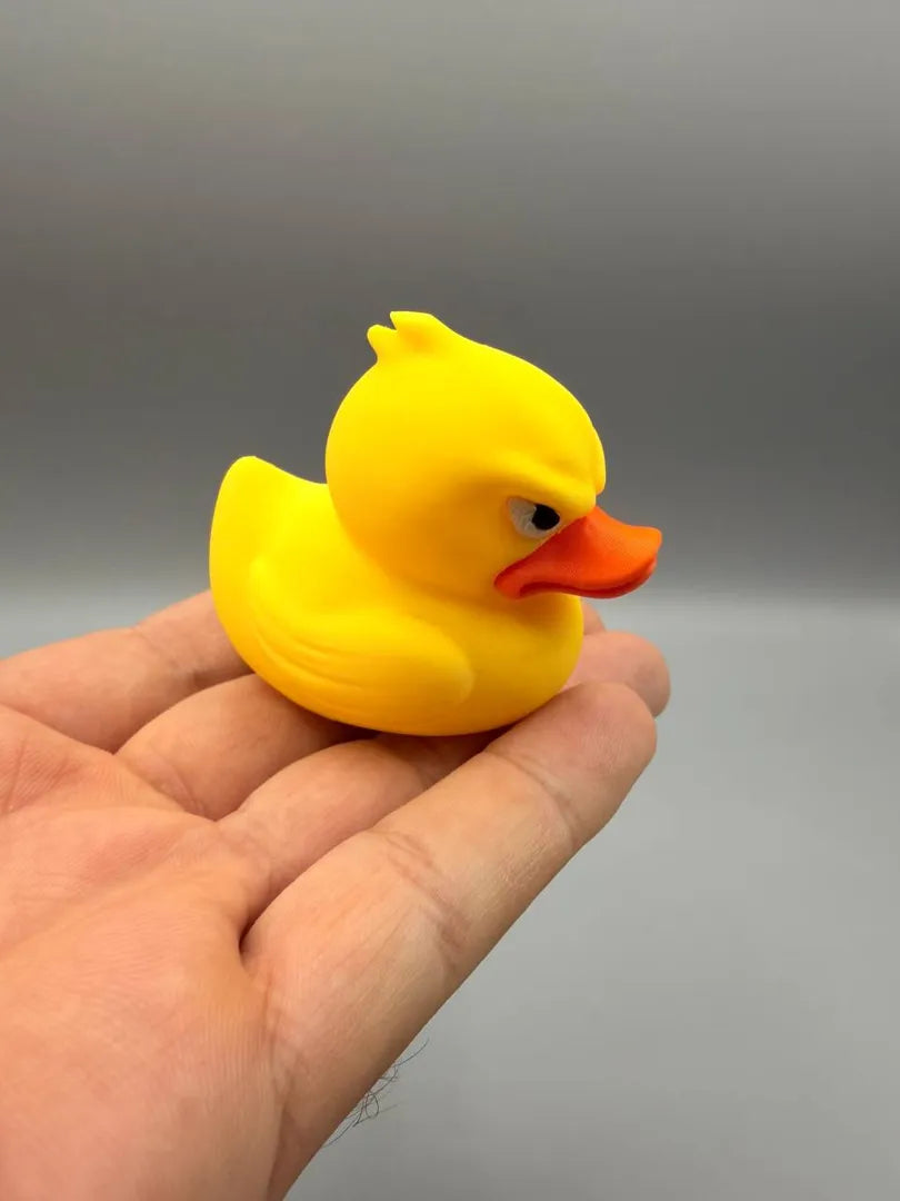 Grumpy Ducky held in a hand to show its size