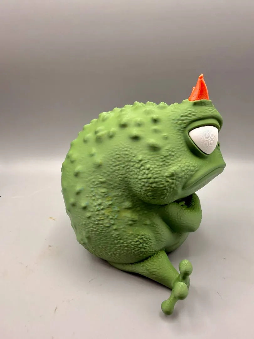 Grumpy Frog sculpture, side view