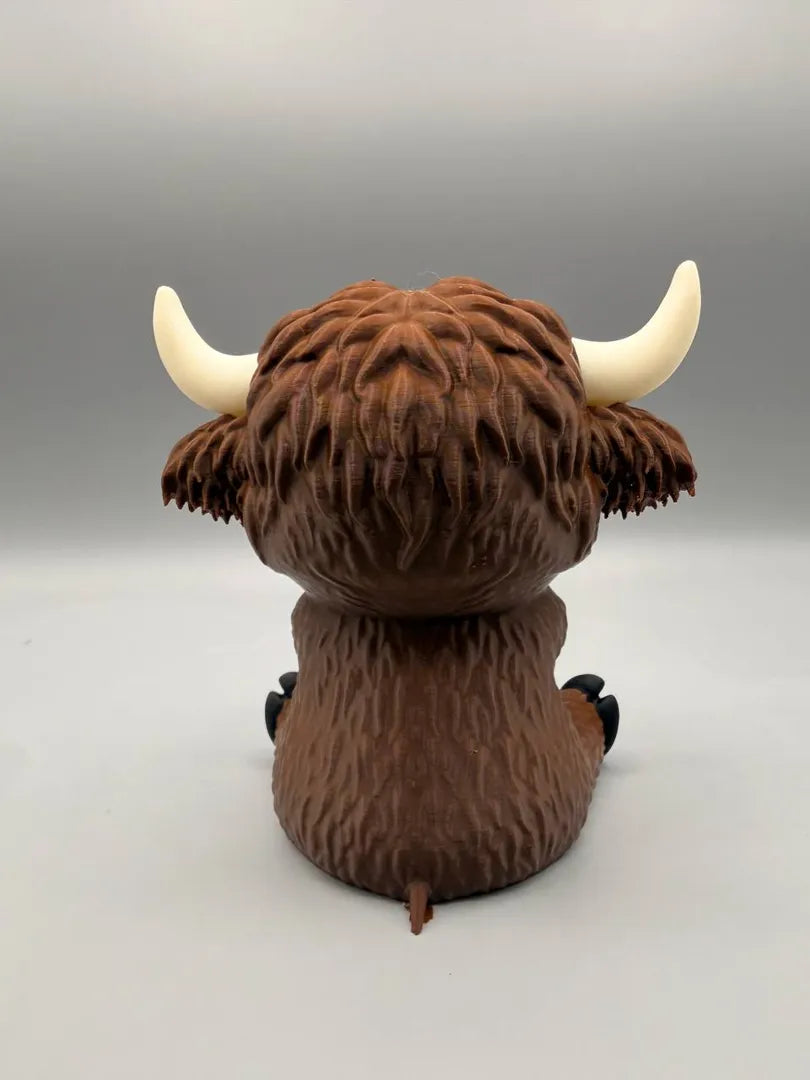 Grumpy Highland Cow sculpture, back view