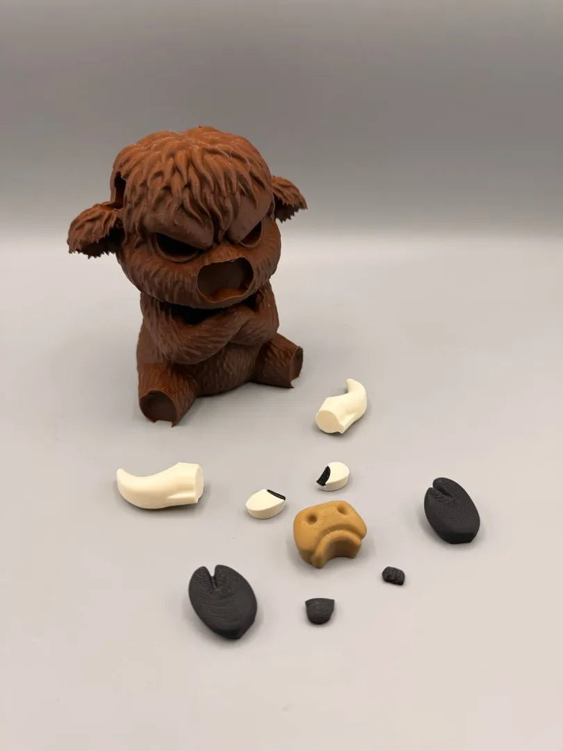 Grumpy Highland Cow shown with its separately printed parts before assembly