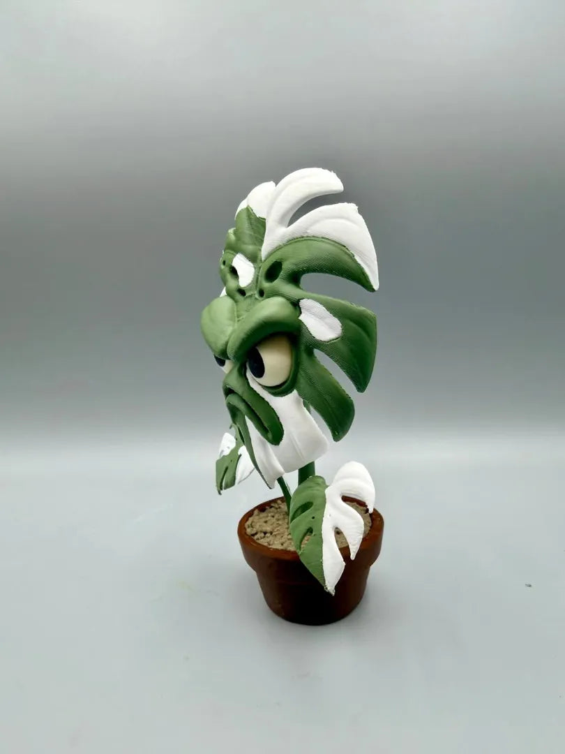 Grumpy Monstera sculpture, three-quarter view