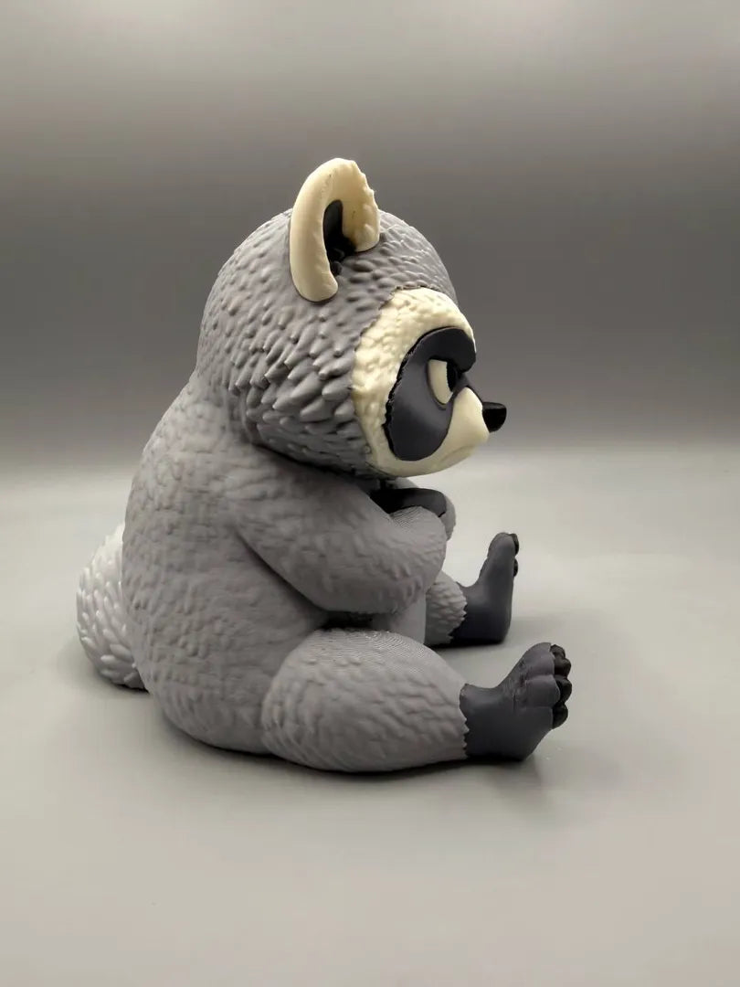 Grumpy Raccoon sculpture, side view