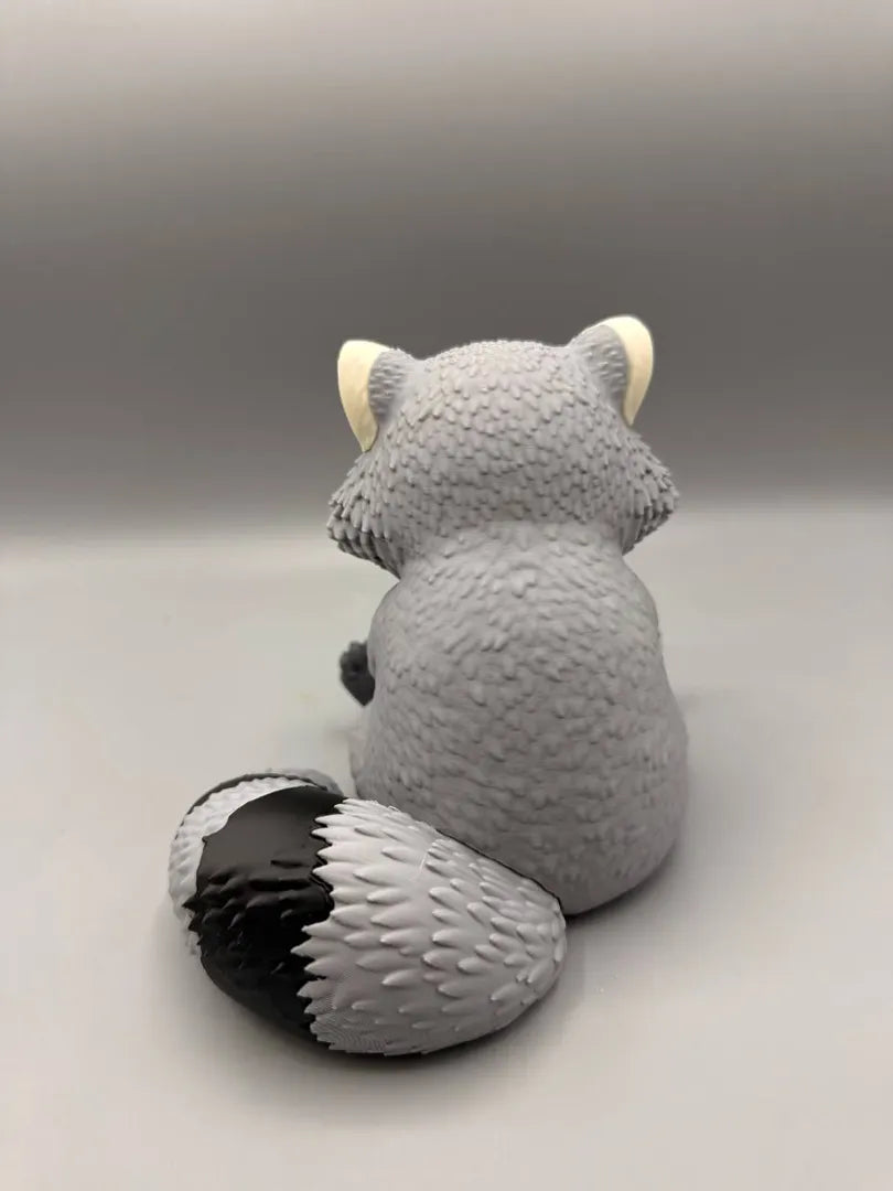 Grumpy Raccoon sculpture, back view