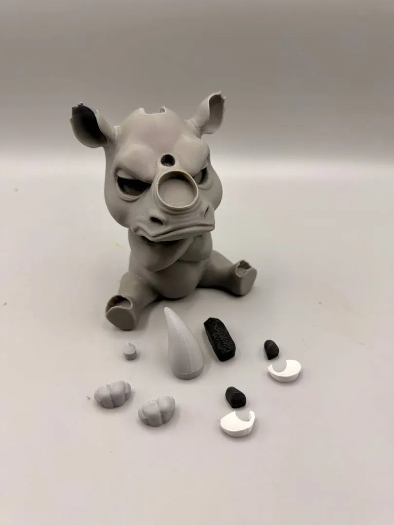 Grumpy Rhino shown with its separately printed parts before assembly