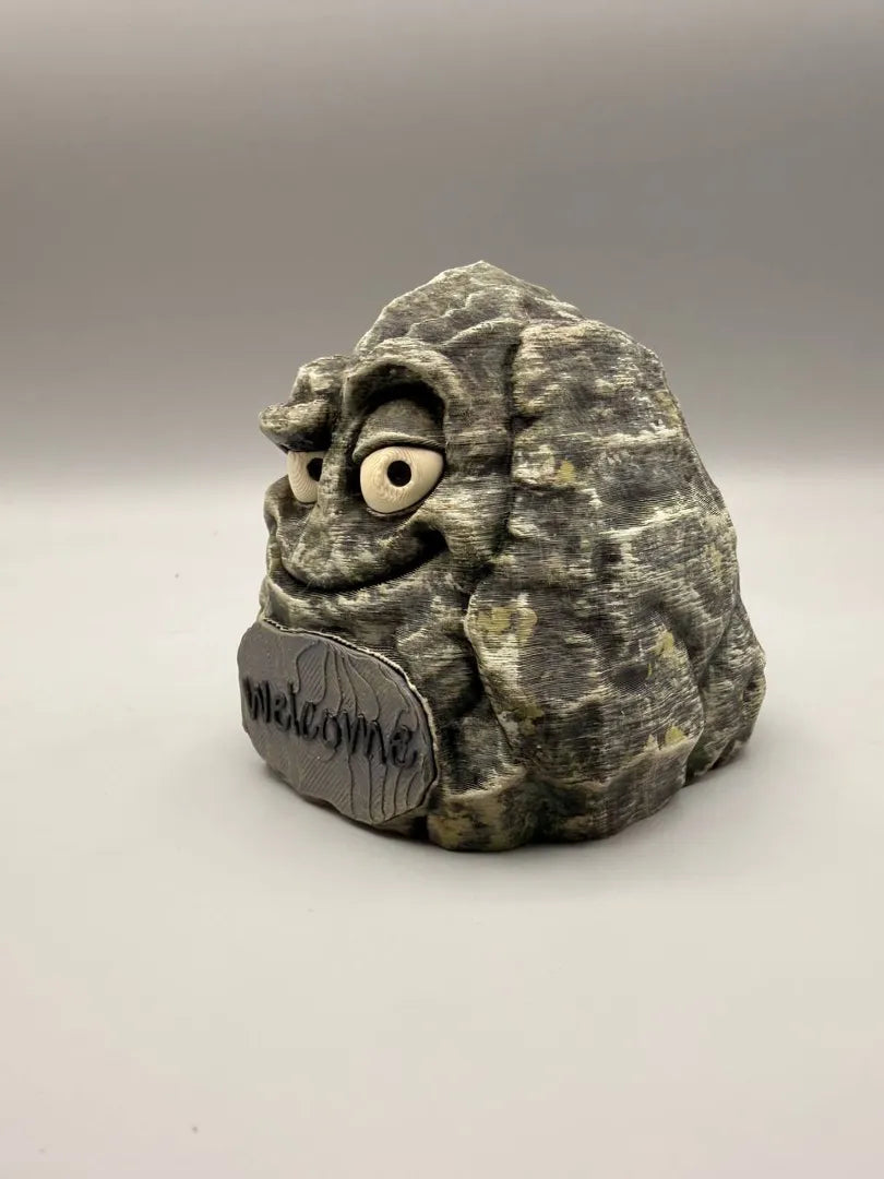 Happy Stone with its Welcome sign, three-quarter view