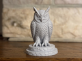 Majestic Owl sculpture on a stone base
